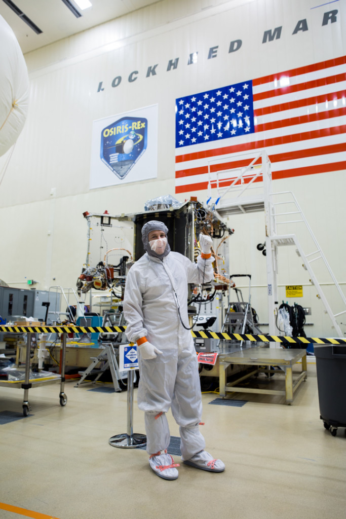 Systems Engineer Bradley Williams with the OSIRIS-REx spacecraft in the Lockheed Martin cleanroom.