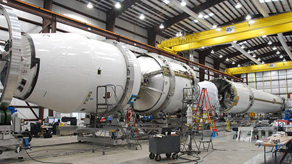 Falcon 9 flight hardware undergoing final integration earlier this month in the hangar at SpaceXs Cape Canaveral launch site in Florida. Credit: SpaceX.