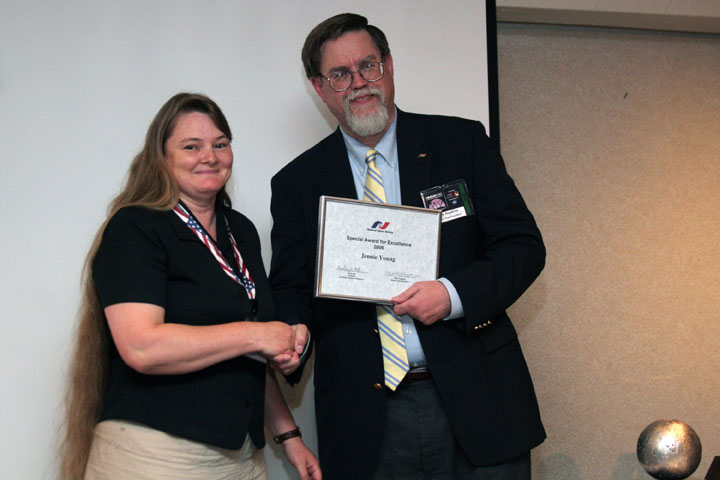 Jennie Young accepts an NSS Award for Excellence from Mark Hopkins at 2006 International Space Development Conference