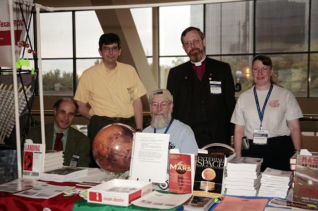 Members of the Mars Society pose at their booth at the International Space Development Conference  