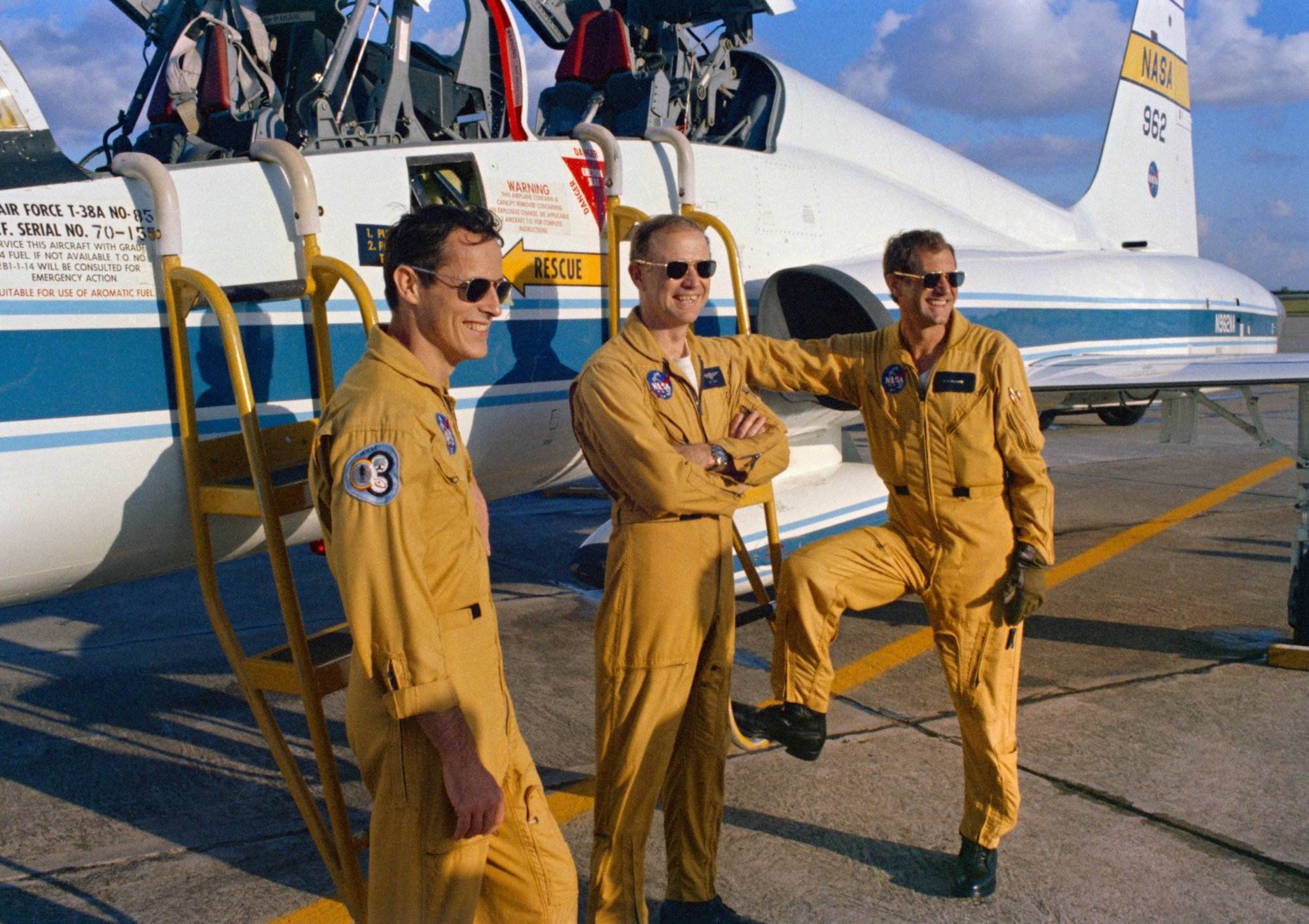 The prime crewmen of the third manned Skylab mission (Skylab 4) pause at a USAF T-38A jet at Ellington Air Force Base, Texas