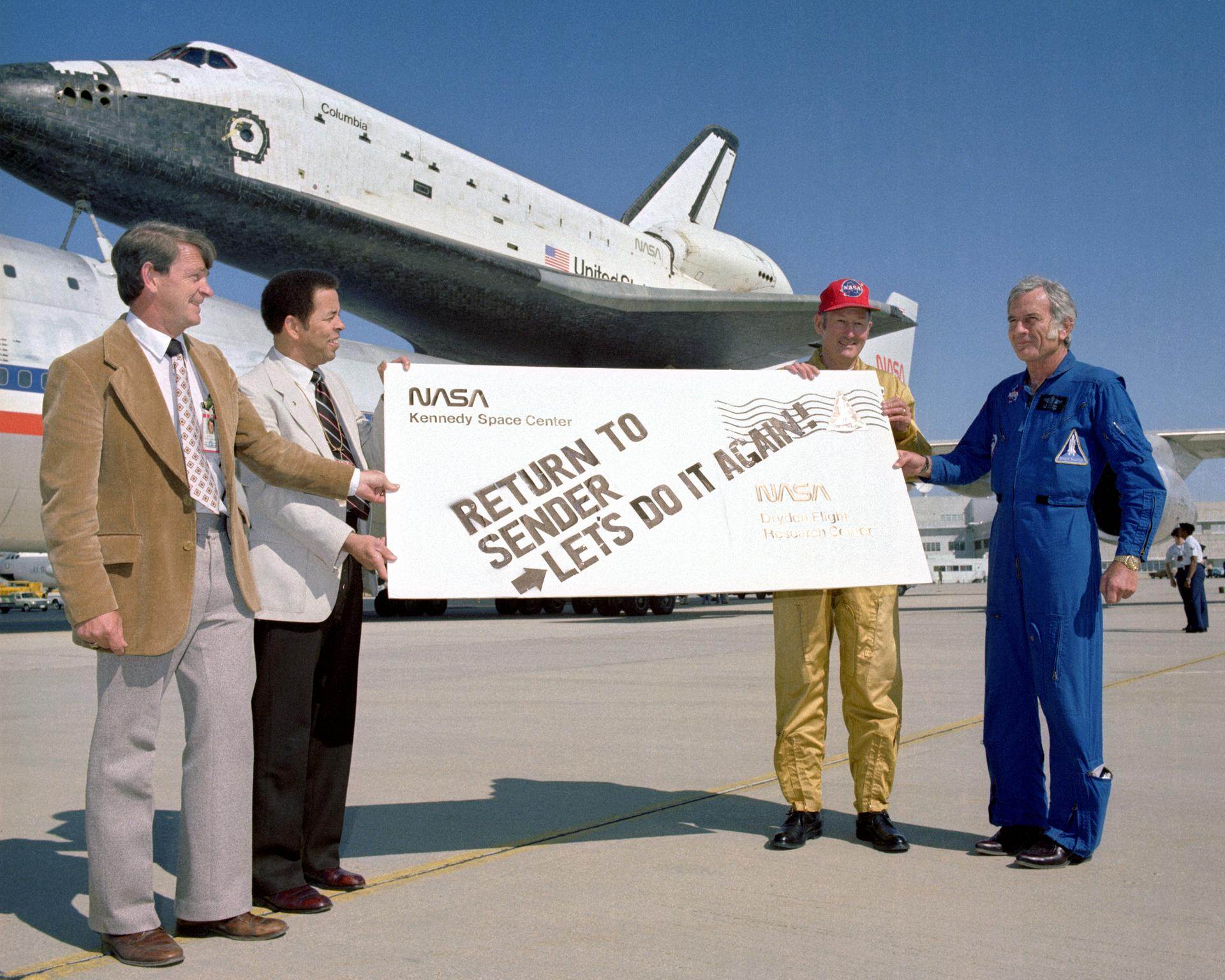 Melvin Burke, Ike Gillam, Fitz Fulton, and Deke Slayton give the Space Shuttle Columbia a humorous sendoff before it's ferry flight back to KSC in Florida